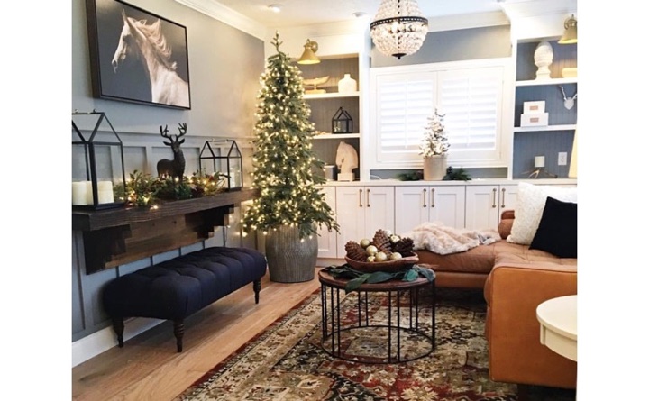 Living room with hardwood floors and plantation shutters.